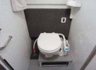 Optional enclosed stand-up head or choose flush toilet inside bench seat option
