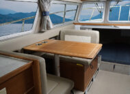 Port side dinette seating converts to bed, v-berth cuddy with memory foam mattress upgrade