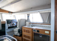 Well appointed galley include white shalestone counter tops, sapele wood cabinets with well appointed storage
