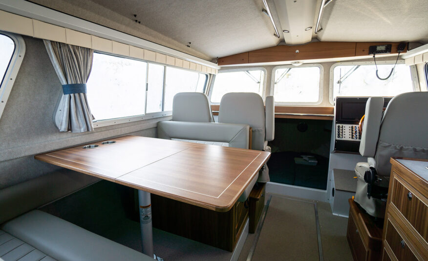 Spacious cabin with dual port side suspension seats