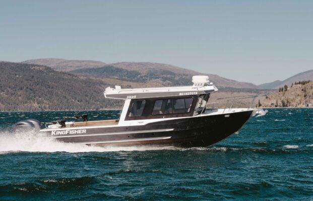 2825 KingFisher Coastal Express starboard profile on calm mountain lake