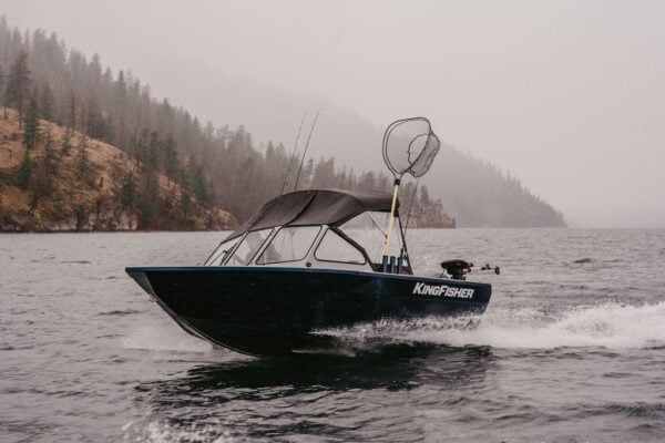 KingFisher 16 Falcon port side profile running on calm mountain lake